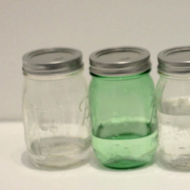 picture of Ball jars, one is green